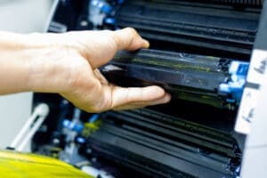 Technicians replacing toner in laser printer concept office supp